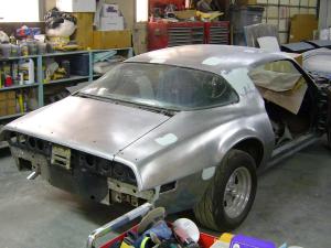 Car stripped to bare metal